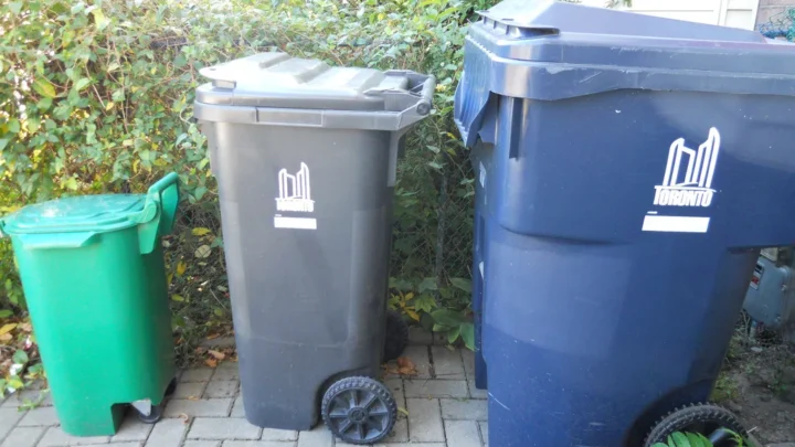 Green,grey and blue wheeled collection bins outside a Toronto home in 2010