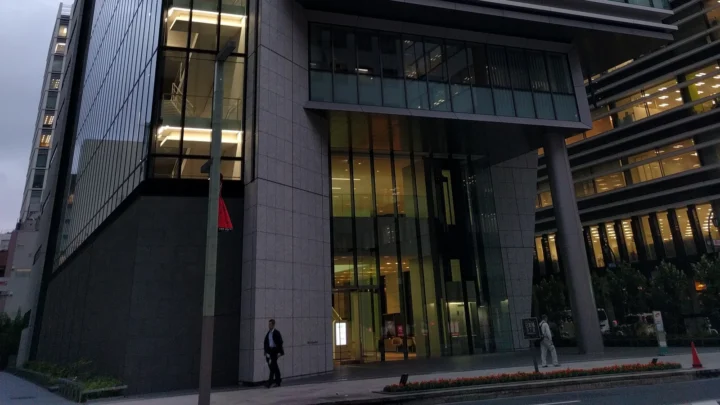 The lower facade and entrance of DIC Corporation’s headquarters building in Tokyo.